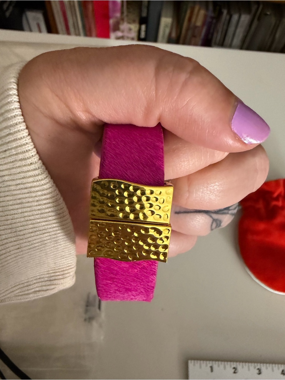 Rustic Cuff Red Velvet Pouch with Aqua Drawstring and Gold Logo and bracelet